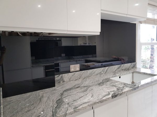 Black painted kitchen splashback